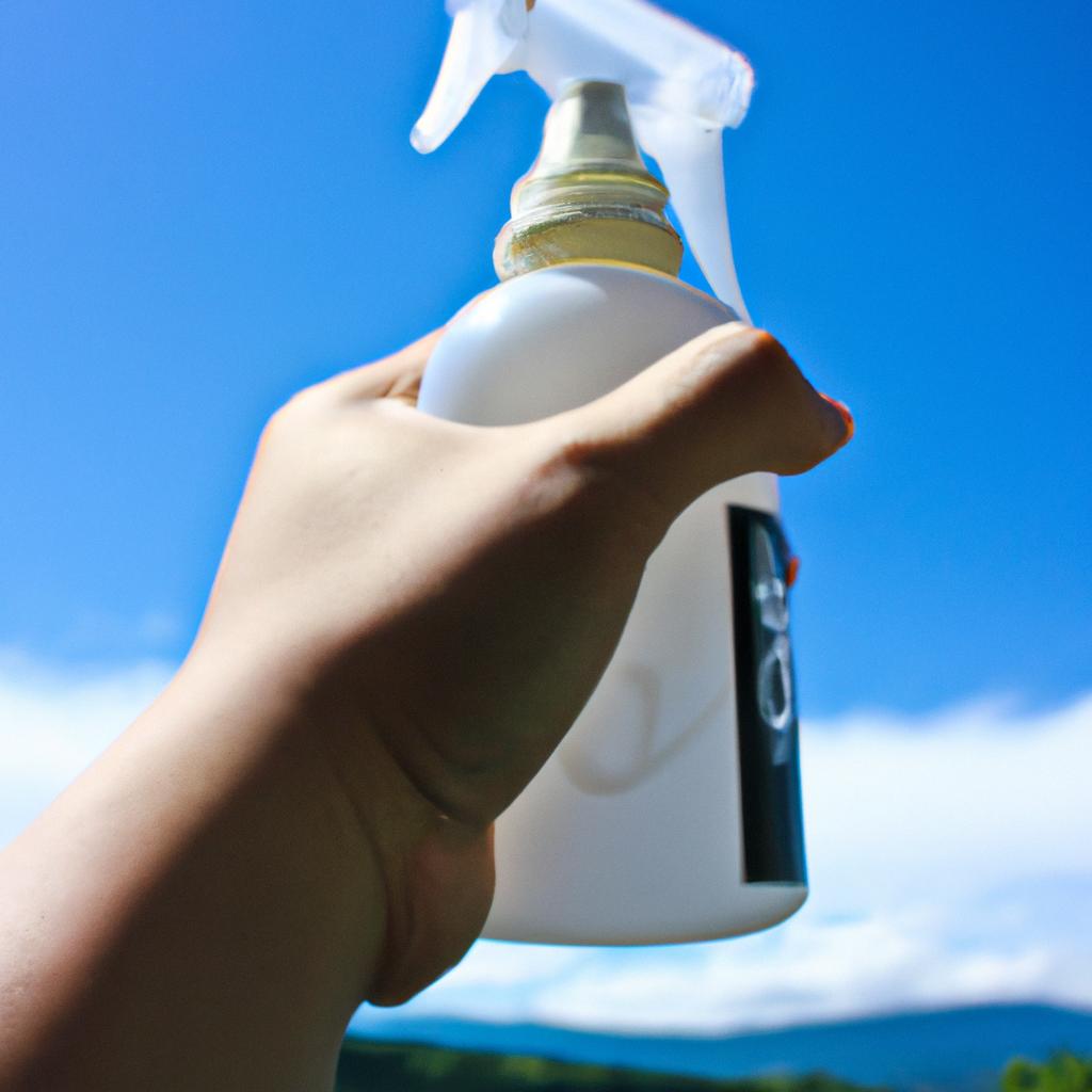 Person holding pesticide spray bottle
